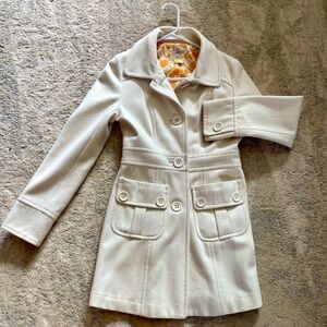 Tulle Cream Trench Coat with Button Details and modern print lining.